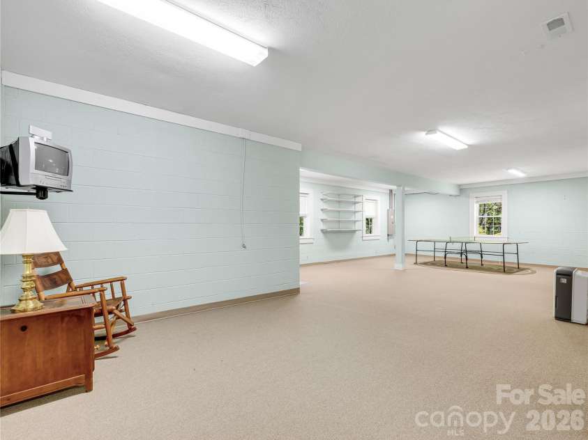 212 Glen Echo Circle, Saluda, NC 28773.  MLS# CAR4369603, YatesRealty ID 15139. Large recreation room (not currently heated)