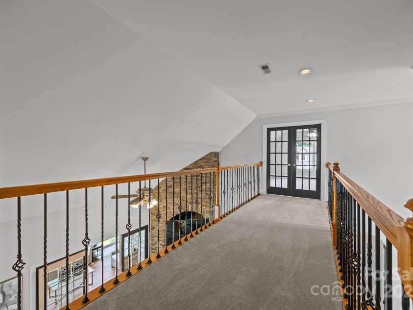 389 Ponderosa Circle, Mooresville, NC 28117.  MLS# CAR4260219, YatesRealty ID 15140. Open and airy catwalk - upper level leading to bonus room.