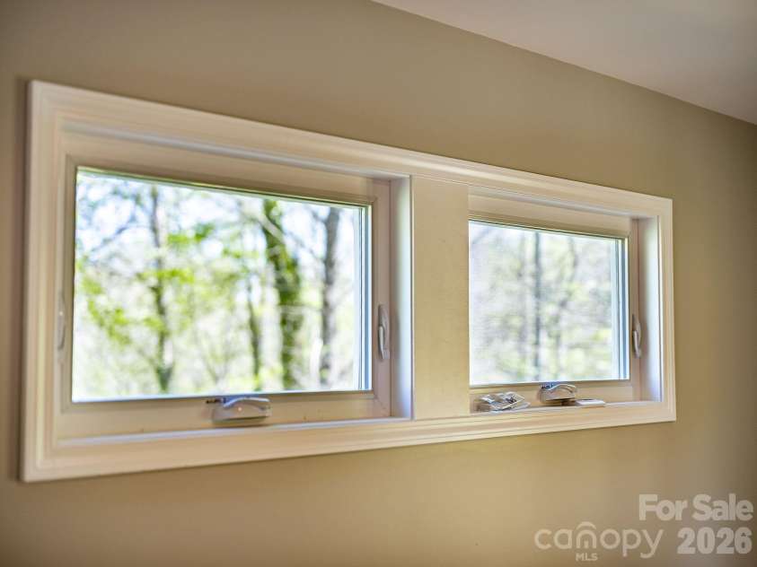1196 Crabtree Road, Waynesville, NC 28785.  MLS# CAR4367690, YatesRealty ID 15143. Transom windows in primary bedroom