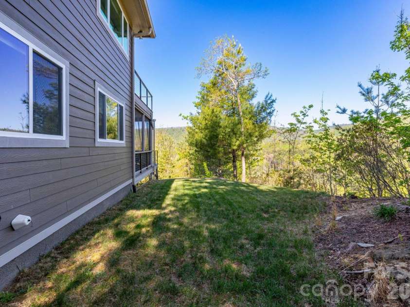 36 Spy Pointe Lane, Fletcher, NC 28732.  MLS# CAR4372672, YatesRealty ID 15149. Side Yard