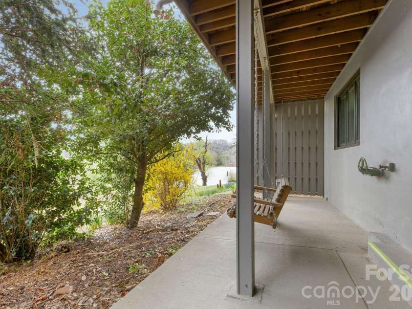 403 Crowfields Drive, Asheville, NC 28803.  MLS# CAR4348824, YatesRealty ID 15152. Lower patio