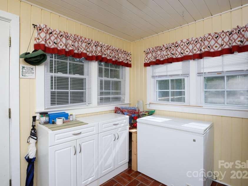 1115 Old Thompson Avenue, Lancaster, SC 29720.  MLS# CAR4249647, YatesRealty ID 15154. Laundry with cabinets and freeezer