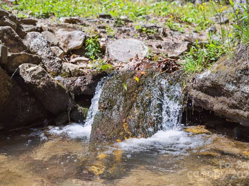 5712 Summit Road, Purlear, NC 28665.  MLS# CAR4141857, YatesRealty ID 1516. Spring Fed Creeks