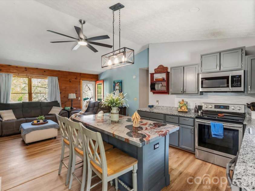 187 Cedarwood Drive, Waynesville, NC 28785.  MLS# CAR4368714, YatesRealty ID 15166. Kitchen looking towards living room