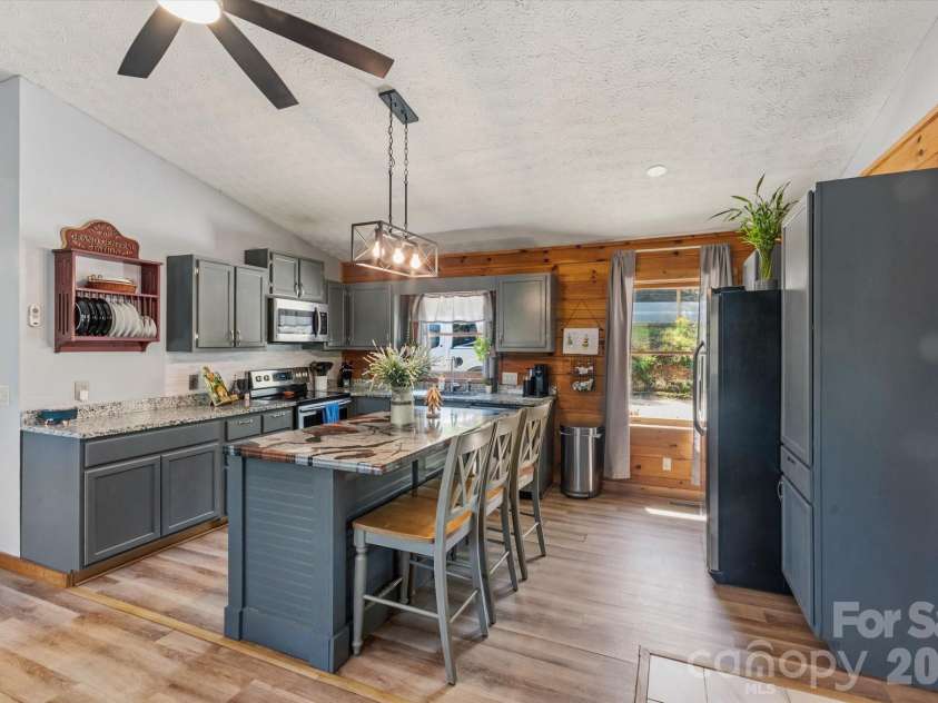 187 Cedarwood Drive, Waynesville, NC 28785.  MLS# CAR4368714, YatesRealty ID 15166. Kitchen with island with seating