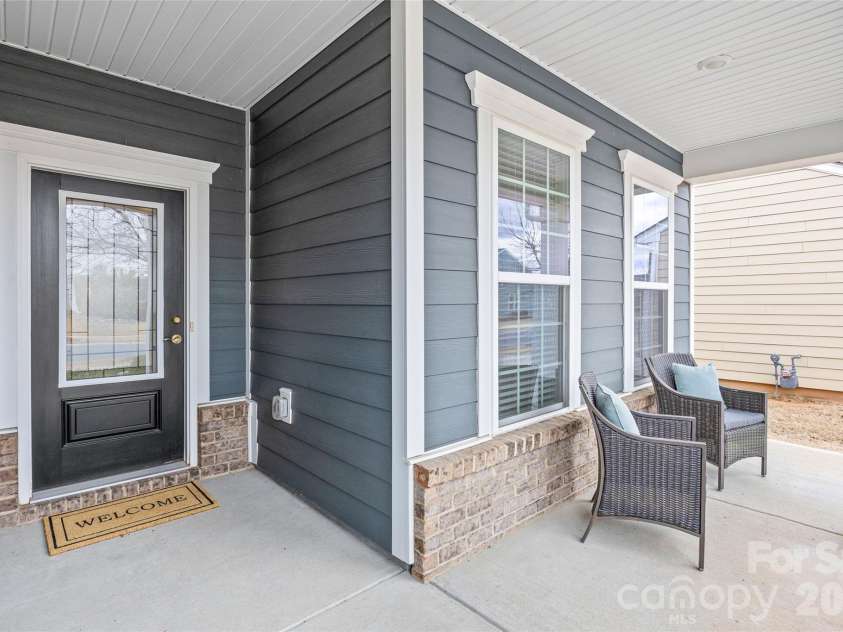 8122 Asher Chase Trail, Lancaster, SC 29720.  MLS# CAR4350544, YatesRealty ID 15169. A charming covered front porch greets you.