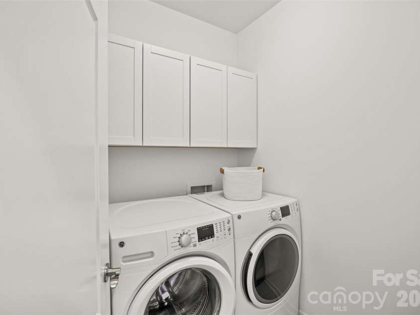 8122 Asher Chase Trail, Lancaster, SC 29720.  MLS# CAR4350544, YatesRealty ID 15169. Laundry Room with cabinets