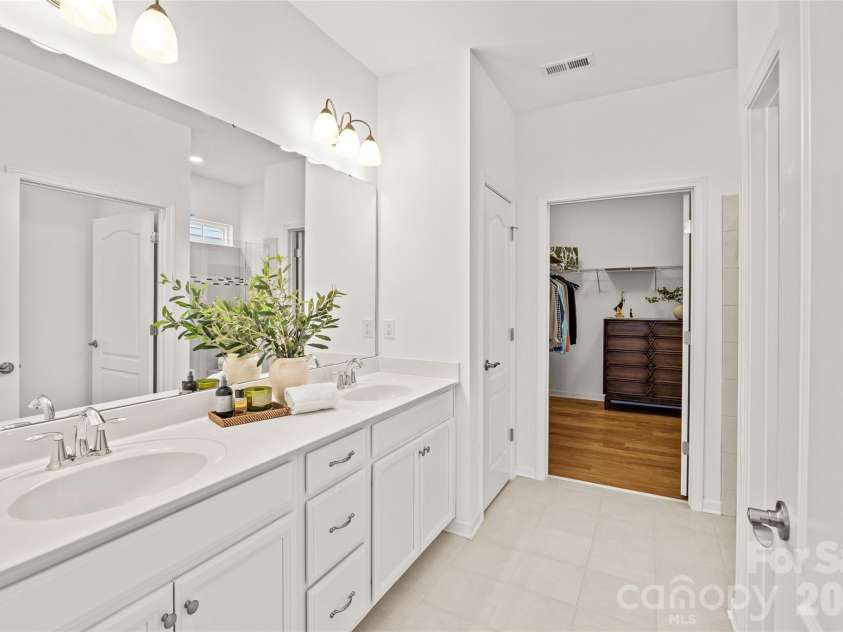 8122 Asher Chase Trail, Lancaster, SC 29720.  MLS# CAR4350544, YatesRealty ID 15169. The primary bathroom with double vanities