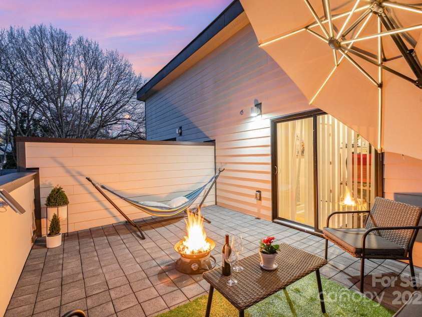 1115 Greenleaf Avenue, Charlotte, NC 28202.  MLS# CAR4248840, YatesRealty ID 15173. Rooftop Terrace Evening Looking Toward Skyline