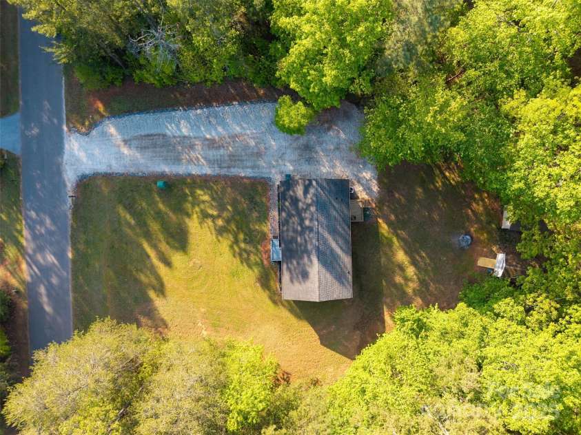 5039 Pine Springs Drive, Bessemer City, NC 28016.  MLS# CAR4249727, YatesRealty ID 15175. Aerial shot of the property looking down onto the house.