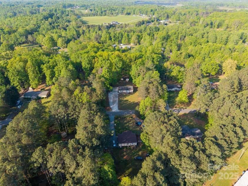 5039 Pine Springs Drive, Bessemer City, NC 28016.  MLS# CAR4249727, YatesRealty ID 15175. Aeriel shot showing the property front facing and center of the photo to showcase the privacy of the .69ac lot