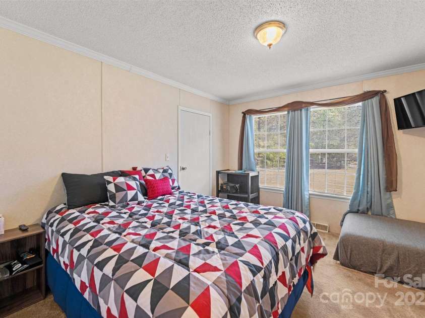 5039 Pine Springs Drive, Bessemer City, NC 28016.  MLS# CAR4249727, YatesRealty ID 15175. Bedroom 2 located at the front of the house and host a large walk in closet with plenty of storage