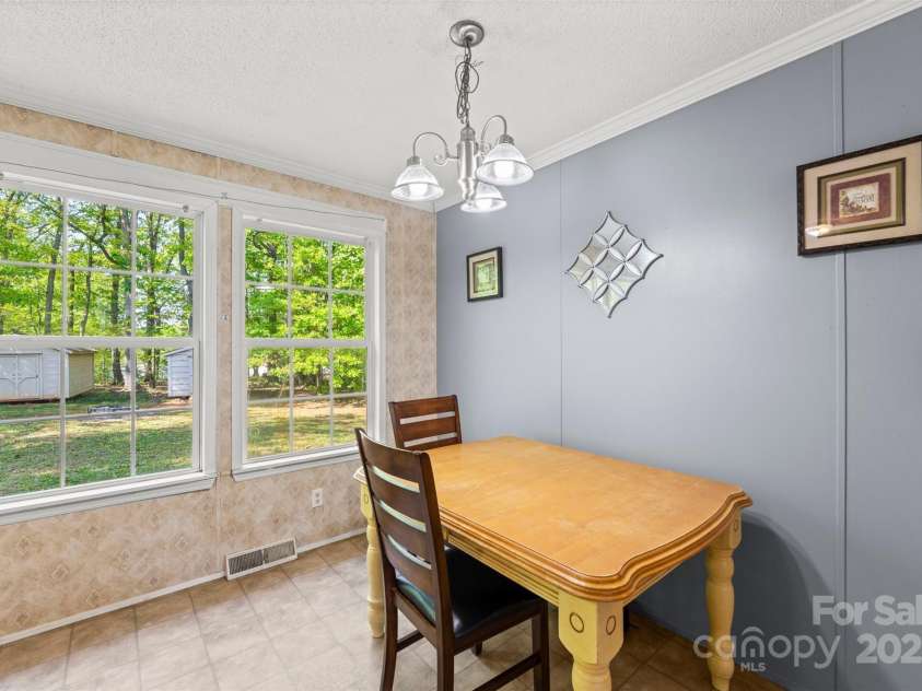 5039 Pine Springs Drive, Bessemer City, NC 28016.  MLS# CAR4249727, YatesRealty ID 15175. Breakfast area part of the kitchen with lots of natural light