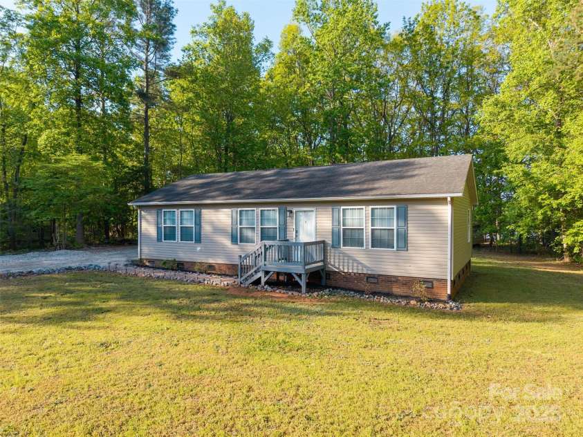 5039 Pine Springs Drive, Bessemer City, NC 28016.  MLS# CAR4249727, YatesRealty ID 15175. Plenty of yard space and freshly painted front deck