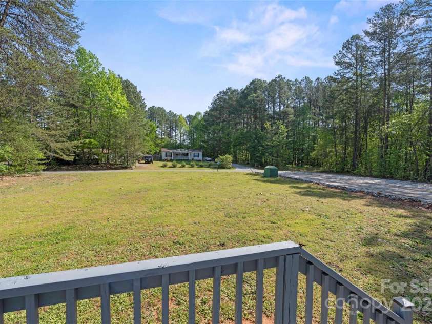 5039 Pine Springs Drive, Bessemer City, NC 28016.  MLS# CAR4249727, YatesRealty ID 15175. View looking into the front yard from the front door