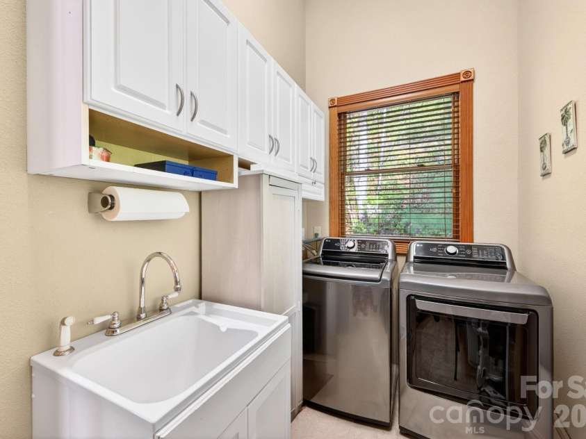 80 Valley View Drive, Marion, NC 28752.  MLS# CAR4365654, YatesRealty ID 15175. Laundry room on the main level off the kitchen.