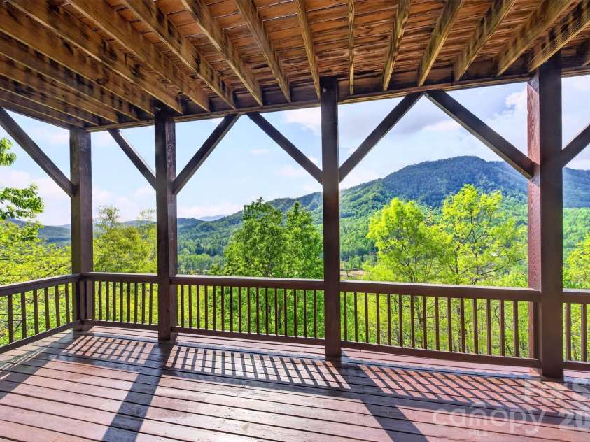 80 Valley View Drive, Marion, NC 28752.  MLS# CAR4365654, YatesRealty ID 15175. Lowest level covered porch with same amazing long range views.