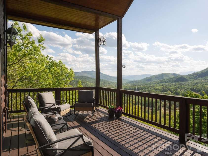 80 Valley View Drive, Marion, NC 28752.  MLS# CAR4365654, YatesRealty ID 15175. Main level covered wrap around porch.