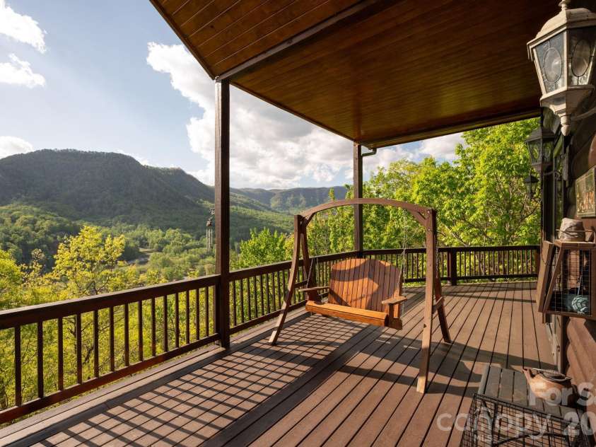 80 Valley View Drive, Marion, NC 28752.  MLS# CAR4365654, YatesRealty ID 15175. Main level covered wrap around porch.