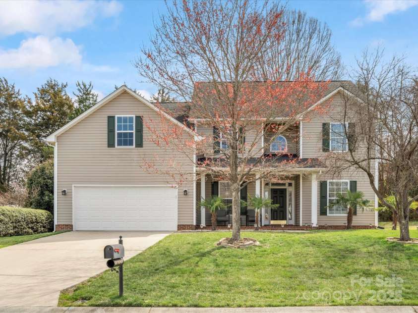 2100 Bluebonnet Lane, Matthews, NC 28104.  MLS# CAR4229213, YatesRealty ID 15179. Front of house