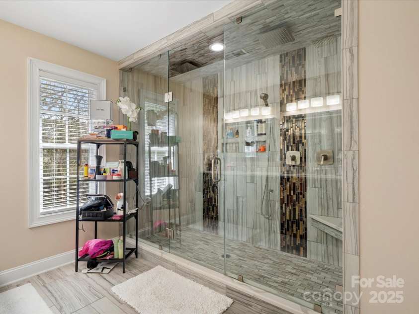 2100 Bluebonnet Lane, Matthews, NC 28104.  MLS# CAR4229213, YatesRealty ID 15179. LUXURY Primary shower