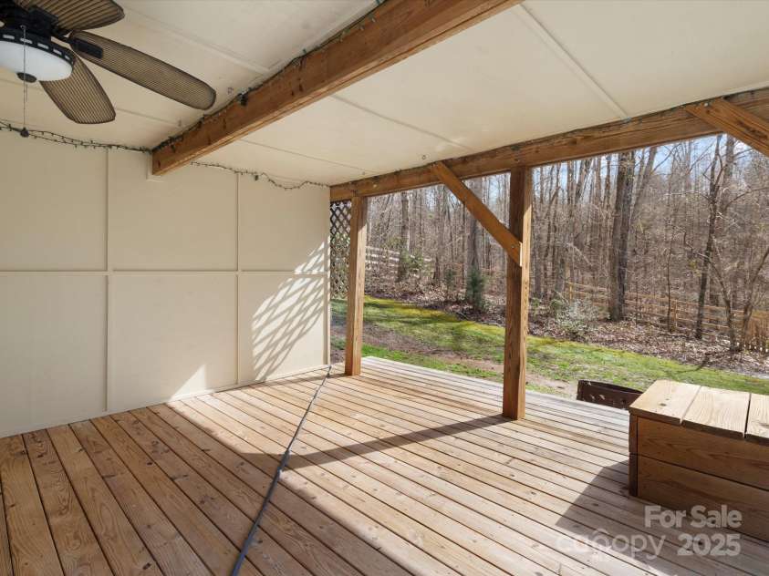 14723 Sapphire Lane, Pineville, NC 28134.  MLS# CAR4228552, YatesRealty ID 15180. Covered porch off of the walk out basement