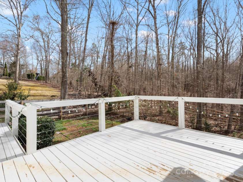 14723 Sapphire Lane, Pineville, NC 28134.  MLS# CAR4228552, YatesRealty ID 15180. Side deck perfect for grilling! Love the privacy back here!