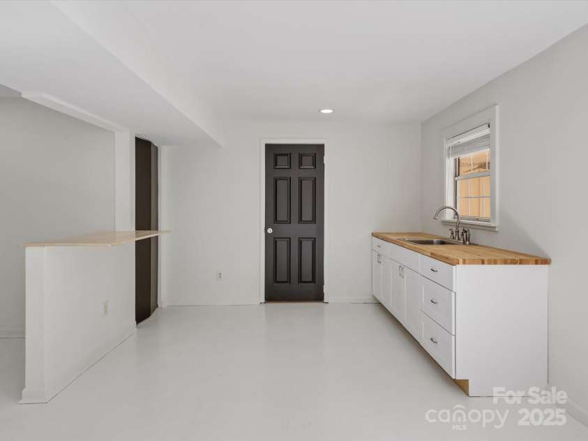 14723 Sapphire Lane, Pineville, NC 28134.  MLS# CAR4228552, YatesRealty ID 15180. Walk out basement ready for any of your needs!