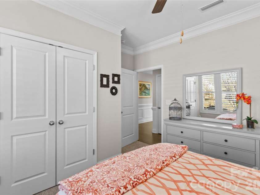 112 Canada Drive, Statesville, NC 28677.  MLS# CAR4330595, YatesRealty ID 15189. Front bedroom with crown molding, large customized closet