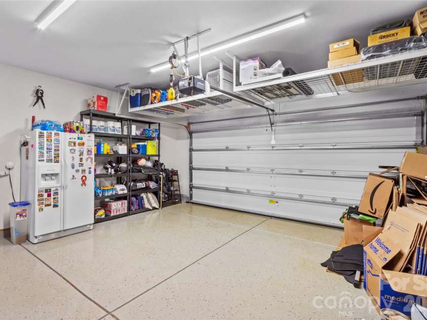 112 Canada Drive, Statesville, NC 28677.  MLS# CAR4330595, YatesRealty ID 15189. Garage with epoxy flooring, storage racks