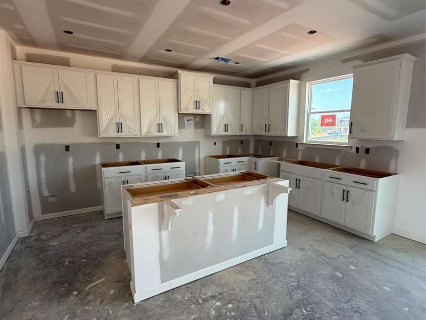 317 Maidstone Drive, Monroe, NC 28110.  MLS# CAR4237883, YatesRealty ID 15189. Large kitchen with island and great walk-in pantry