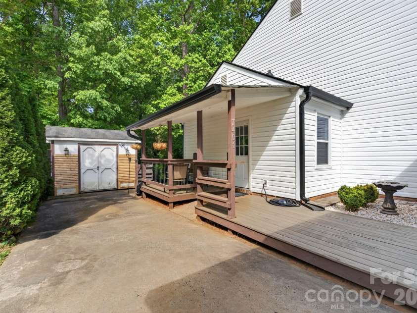 7401 Beaufort Circle, Charlotte, NC 28227.  MLS# CAR4372097, YatesRealty ID 15190. Side porch and storage shed.
