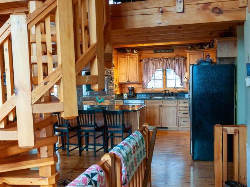 125 Turkey Ridge Trail, McGrady, NC 28649.  MLS# CAR4252396, YatesRealty ID 15196. Spiral Staircase to Upper Level Loft