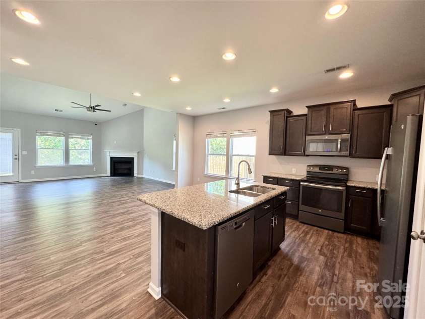 11109 Pond Valley Court, Charlotte, NC 28269.  MLS# CAR4273607, YatesRealty ID 15198. Kitchen opens up nicely to vaulted living room