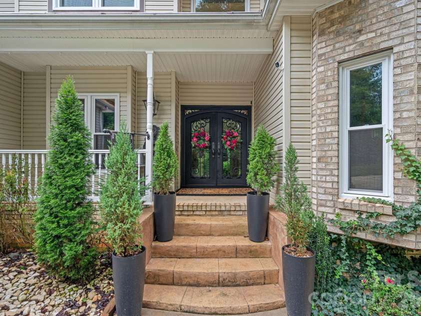 172 Tawny Bark Drive, Mooresville, NC 28117.  MLS# CAR4332757, YatesRealty ID 15204. New custom wrought iron double front doors