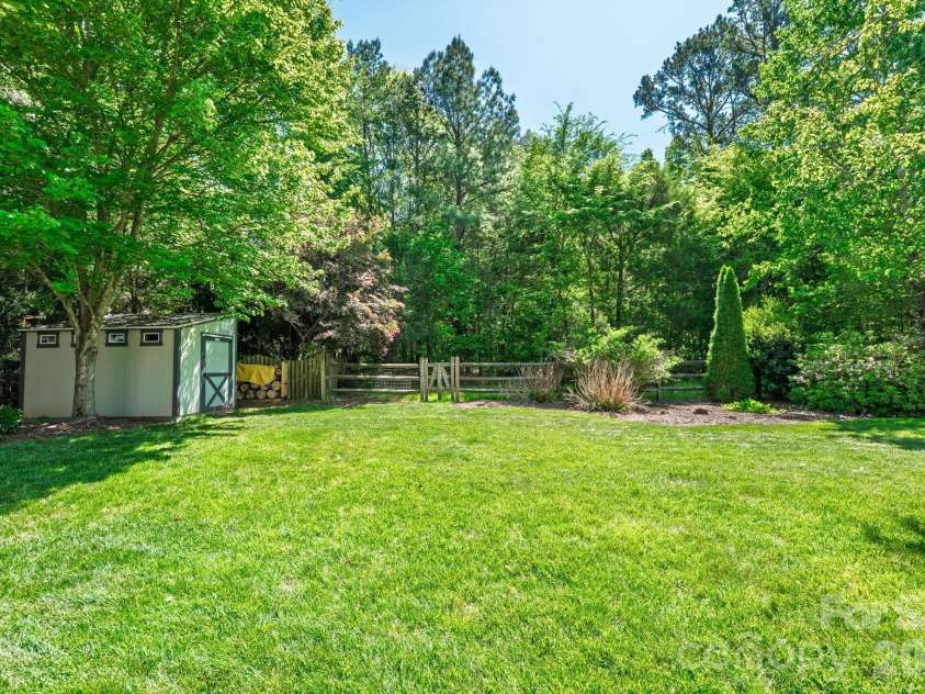 6111 Latta Springs Circle, Huntersville, NC 28078.  MLS# CAR4371848, YatesRealty ID 15205. Level backyard with storage building