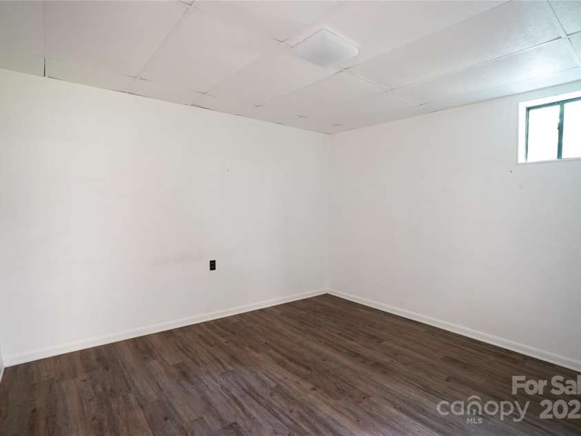 262 Rooster Cove, Brevard, NC 28712.  MLS# CAR4332799, YatesRealty ID 15209. Downstairs room