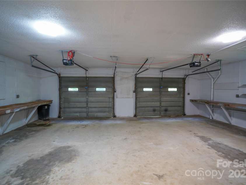 262 Rooster Cove, Brevard, NC 28712.  MLS# CAR4332799, YatesRealty ID 15209. Large double garage
