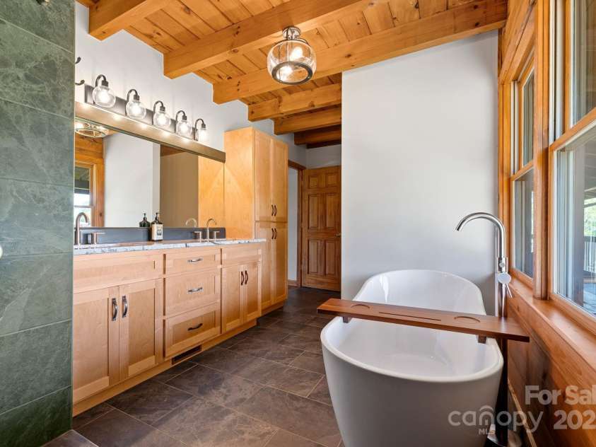 11227 Cool Springs Road, Cleveland, NC 27013.  MLS# CAR4257967, YatesRealty ID 15210. Owner's Suite Bath with Soaking Tub and Separate Hand Laid Tiled Shower