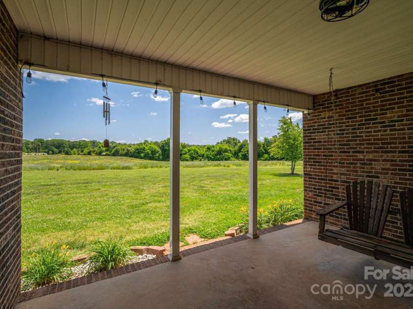 5873 Alexis Lane, Vale, NC 28168.  MLS# CAR4256997, YatesRealty ID 1522. View from front porch.