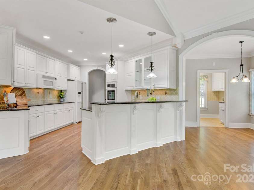 89 Wexford Point, Hickory, NC 28601.  MLS# CAR4250502, YatesRealty ID 15221. View of the kitchen and breakfast room from the keeping room