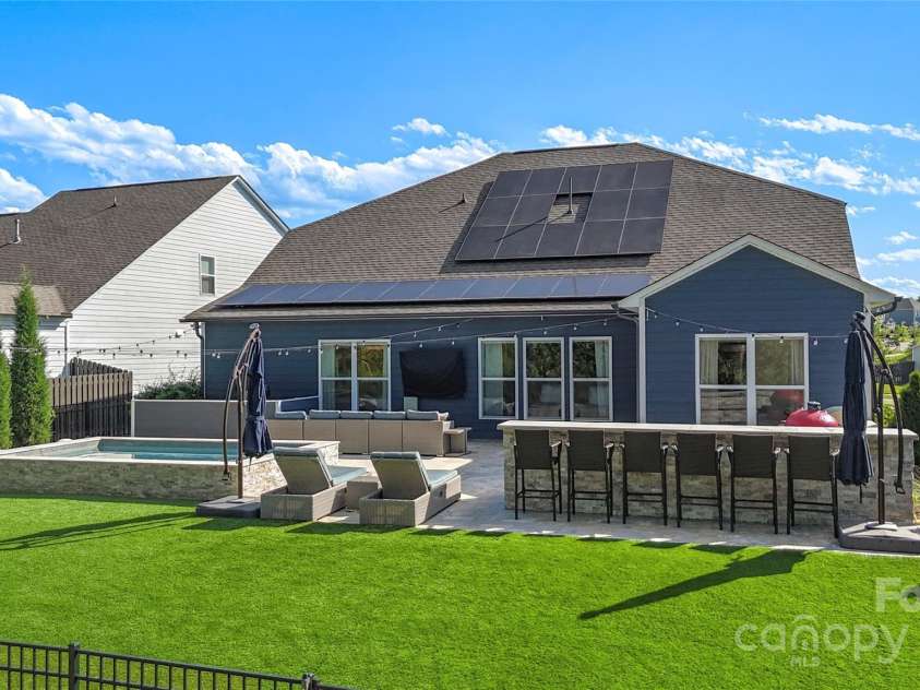 5050 Havencrest Drive, Fort Mill, SC 29715.  MLS# CAR4261068, YatesRealty ID 15224. Backyard oasis, complete with outdoor kitchen, travertine patio + Spool (spa, pool)