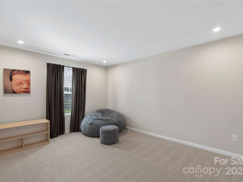 5050 Havencrest Drive, Fort Mill, SC 29715.  MLS# CAR4261068, YatesRealty ID 15224. Oversized loft at the top of the stairs. Complete with excess lighting.