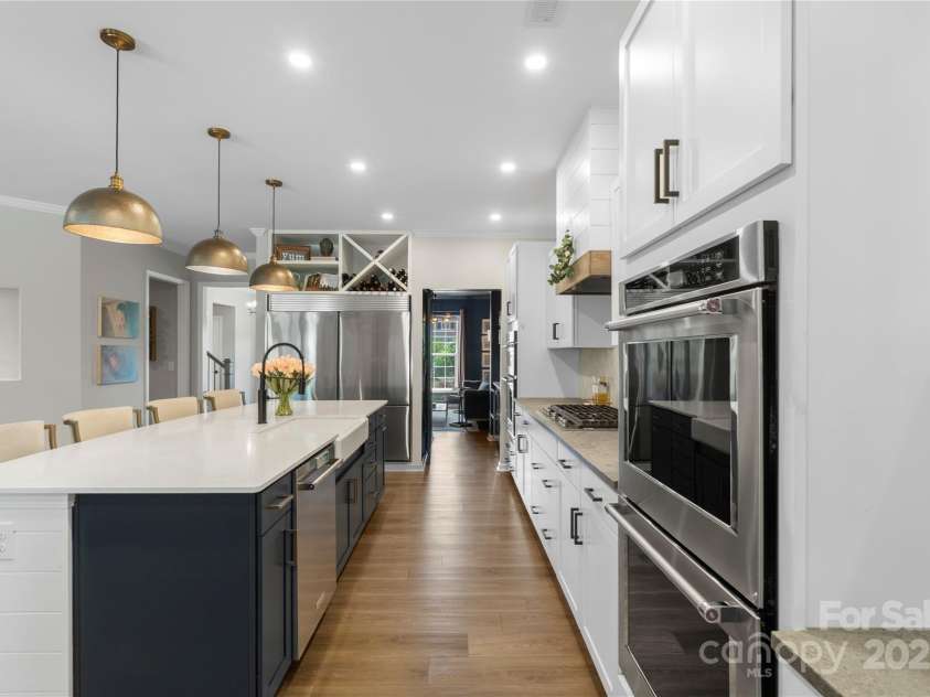 5050 Havencrest Drive, Fort Mill, SC 29715.  MLS# CAR4261068, YatesRealty ID 15224. Shiplap wrapped island with upgraded pendand lighting, molding and art nook.