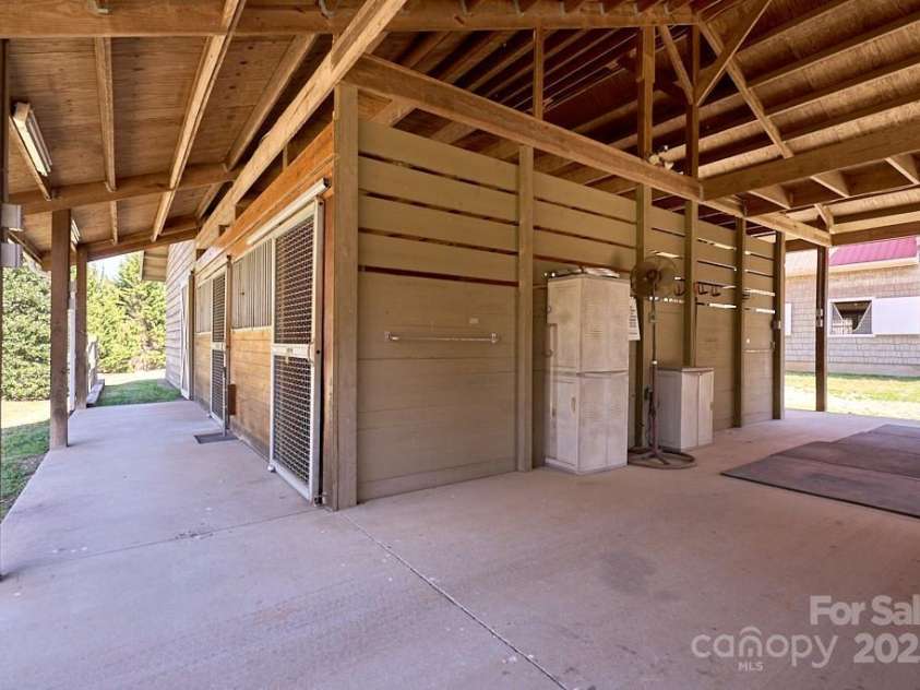 226 John Smith Road, Columbus, NC 28722.  MLS# CAR4235483, YatesRealty ID 15228. 4 stalls, 3 wash stalls, Dry grooming area, Shavings storage, Hay storage, Tool & Tack Room, and more!