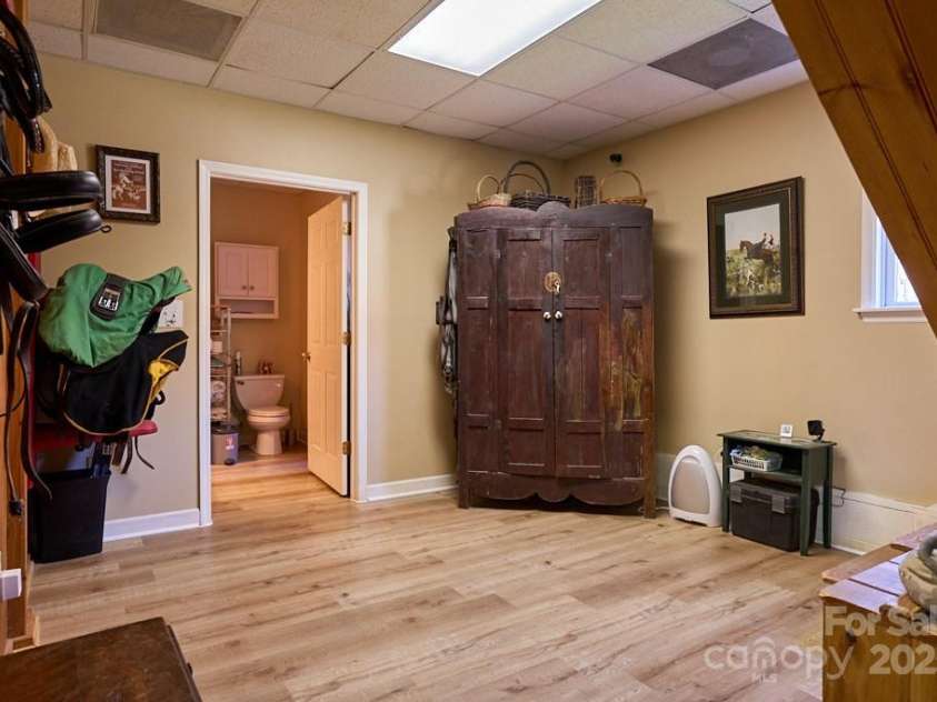 226 John Smith Road, Columbus, NC 28722.  MLS# CAR4235483, YatesRealty ID 15228. Owner's Tack Room with Full bathroom & laundry