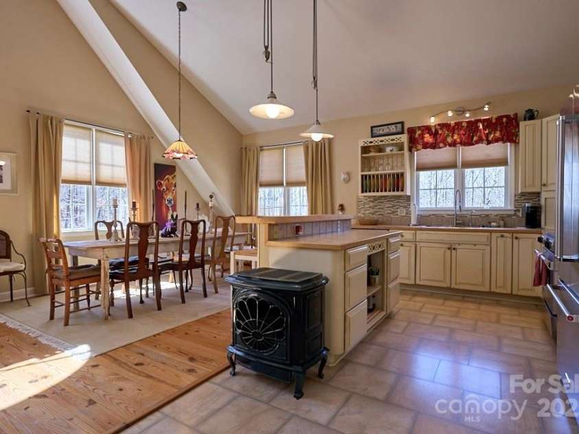 226 John Smith Road, Columbus, NC 28722.  MLS# CAR4235483, YatesRealty ID 15228. Soaring ceilings & elegant finishes throughout. Ventless gas stove for emergency heat.