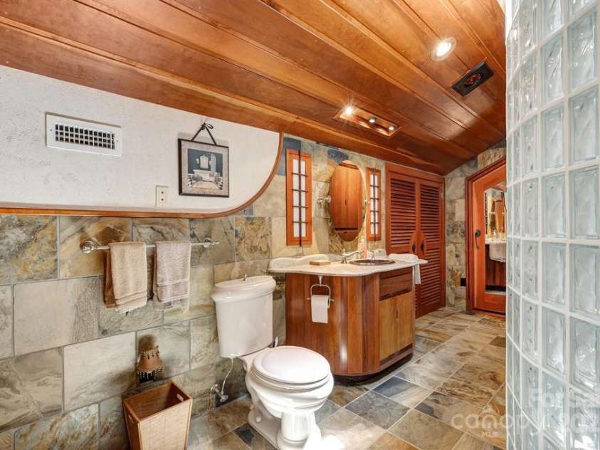 201 Hughes Creek, Columbus, NC 28722.  MLS# CAR4259120, YatesRealty ID 15229. Incredible bathroom with walk-in curved shower