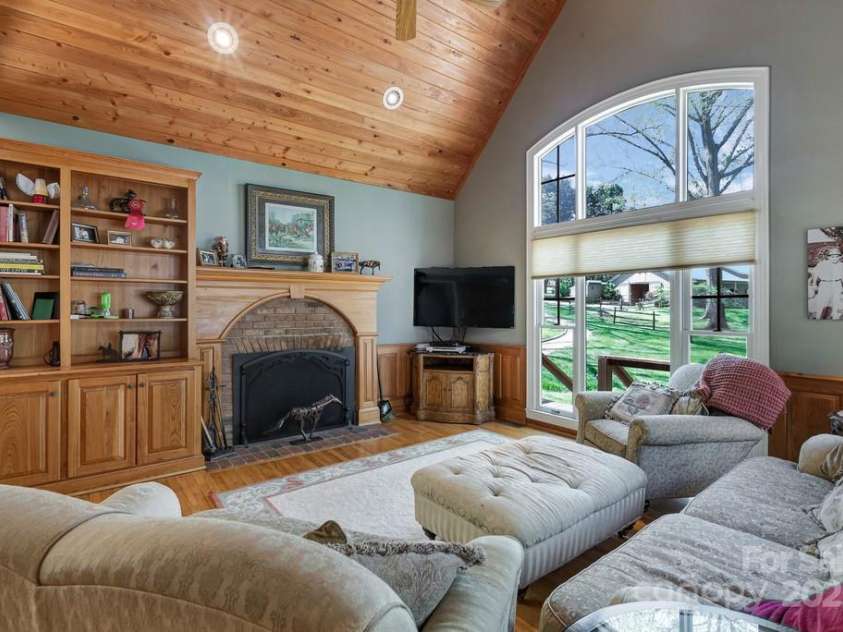 201 Hughes Creek, Columbus, NC 28722.  MLS# CAR4259120, YatesRealty ID 15229. Keeping room with vaulted ceiling and fireplace