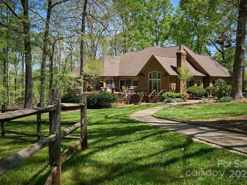 201 Hughes Creek, Columbus, NC 28722.  MLS# CAR4259120, YatesRealty ID 15229. Luxurious brick home on 20 acre horse farm near Tryon, NC